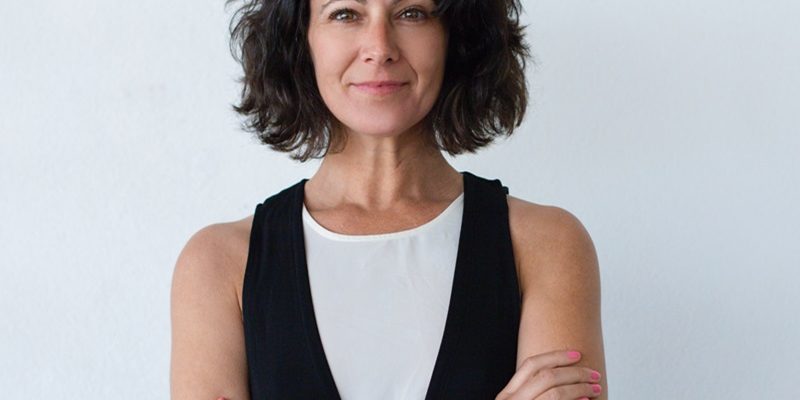Cheerful middle aged woman with curly hair